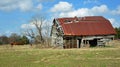 Aged Barn in Field with Horses Royalty Free Stock Photo