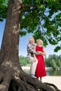 Aged bearded man wearing squared shirt hugging appealing wife Royalty Free Stock Photo