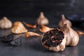 Aged black garlic on table. Space for