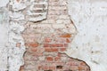 Aged brick wall with cracked plaster Royalty Free Stock Photo