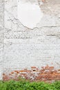 Aged brick wall with cracked plaster Royalty Free Stock Photo