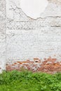 Aged brick wall with cracked plaster Royalty Free Stock Photo