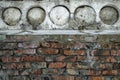 Aged brick wall under concrete cement ceiling background.. Broken bricks. Royalty Free Stock Photo