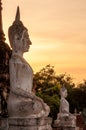 Aged Buddha statue AYUTTHAYA Thailand in sunset