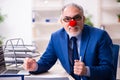 Old businessman clown working in the office Royalty Free Stock Photo