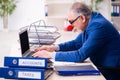 Old businessman clown working in the office Royalty Free Stock Photo