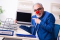 Old businessman clown working in the office Royalty Free Stock Photo