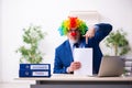 Old businessman clown working in the office Royalty Free Stock Photo