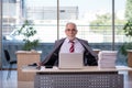Aged businessman employee working in the office Royalty Free Stock Photo