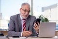 Aged businessman employee working in the office Royalty Free Stock Photo