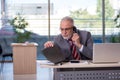 Aged businessman employee working in the office Royalty Free Stock Photo