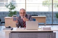 Aged businessman employee working in the office Royalty Free Stock Photo