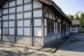 Aged Chinese timber framed house at sunny winter noon Royalty Free Stock Photo