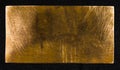 Aged copper plate on black cloth, old worn metal background. Royalty Free Stock Photo