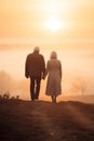 aged couple holding hands. loving couple. back view, rear view, full view. Royalty Free Stock Photo