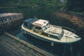 Aged and Dirty Boat and Wooden Dock