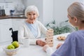 aged disabled woman smiling at camera