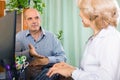 Aged doctor talking with mature male patient Royalty Free Stock Photo
