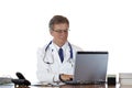 Aged doctor types medical history in laptop