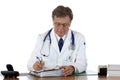 Aged doctor writes down medical report