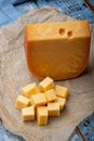 Aged Dutch Gouda cheese and cheese cubes blocks, tasty european food