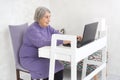 Aged elderly woman working on a laptop Royalty Free Stock Photo