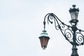 Aged european classic street lamp with broken on the apex