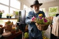 Aged florist teaching about making compositins online