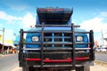 Aged grunge old truck under blue sky