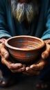 Aged hands clutch empty bowl, selective focus conveying the harshness of poverty Royalty Free Stock Photo