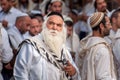 Aged hasid pilgrim in the crowd on the city street. Holiday Rosh Hashanah, Jewish New Year.