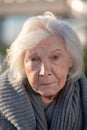 Aged homeless woman with facial wrinkles feeling unprotected Royalty Free Stock Photo