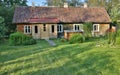 Aged house in the middle of garden Royalty Free Stock Photo