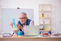Old male designer working in the office Royalty Free Stock Photo