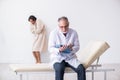 The the aged male doctor psychiatrist examining young patient Royalty Free Stock Photo