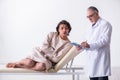 Aged male doctor psychiatrist examining young patient Royalty Free Stock Photo