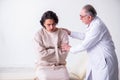 Aged male doctor psychiatrist examining young patient