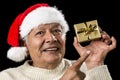 Aged Man With Emphatic Look And Golden Gift