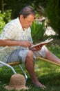 Aged man reading book Royalty Free Stock Photo