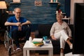 Aged married couple relaxing in living room watching TV Royalty Free Stock Photo