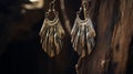 Aged Metal Feather Design Earrings With Dramatic Lighting