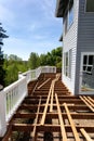 Aged outdoor wooden cedar deck tear down due to weathered boards