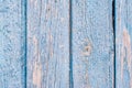 Aged painted cracked boards with blue color peeling. Old natural grunge textured wooden background. Weathered wood wall for design Royalty Free Stock Photo