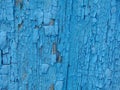 old blue paint on a wooden wall texture. Aged painted cracked boards with blue color peeling paint. Old natural grunge textured Royalty Free Stock Photo