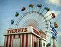 Aged photo of carnival ride and ticket booth