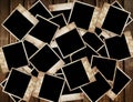 Aged photo frames on wood background Royalty Free Stock Photo