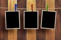 Aged photo frames on wood background Royalty Free Stock Photo