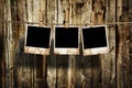 Aged photo frames on wood background Royalty Free Stock Photo