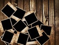 Aged photo frames on wood background Royalty Free Stock Photo