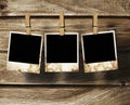 Aged photo frames on wood background Royalty Free Stock Photo